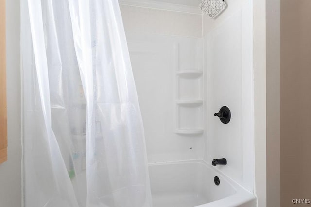 bathroom featuring shower / tub combo with curtain