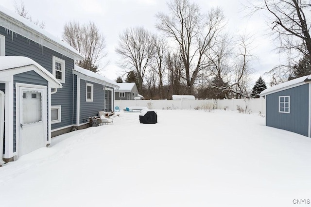 view of yard layered in snow