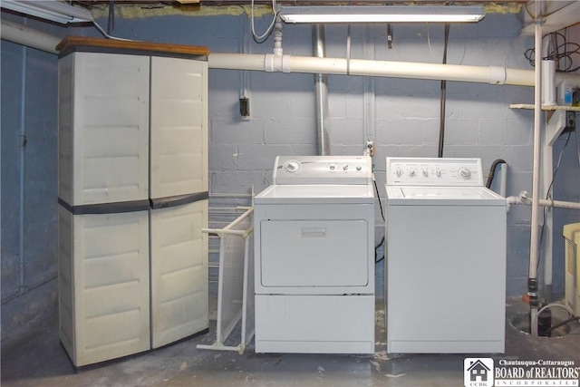 washroom with washing machine and dryer