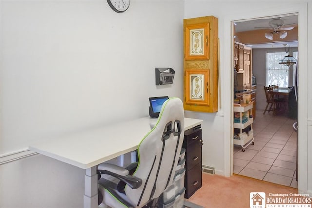 office space with light tile patterned floors and ceiling fan