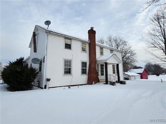 view of snow covered house