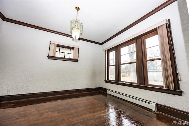 unfurnished room featuring hardwood / wood-style floors, crown molding, a baseboard radiator, and a chandelier