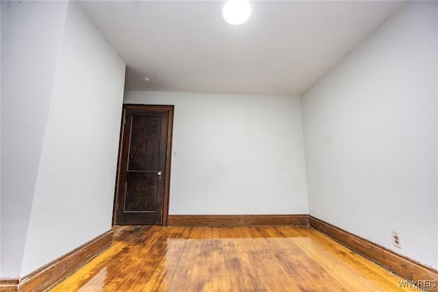 spare room with hardwood / wood-style flooring