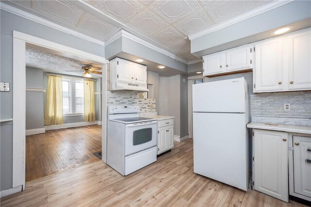 kitchen with white appliances, ceiling fan, tasteful backsplash, white cabinets, and light wood-type flooring