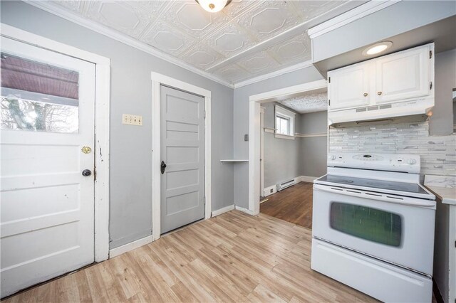 kitchen with crown molding, white range with electric cooktop, light hardwood / wood-style floors, decorative backsplash, and white cabinets