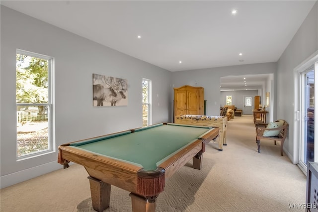 recreation room featuring a wealth of natural light, light carpet, and pool table