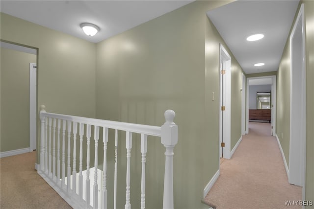 corridor with light colored carpet