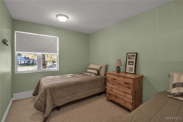 bedroom with light colored carpet