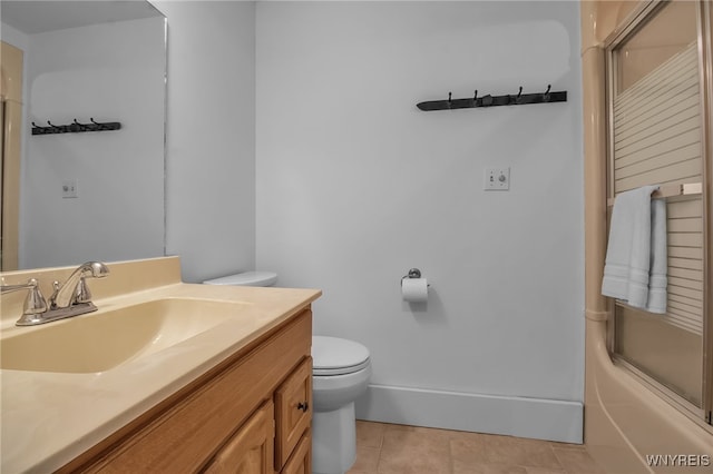 full bathroom with vanity, tile patterned floors, shower / bath combination with glass door, and toilet