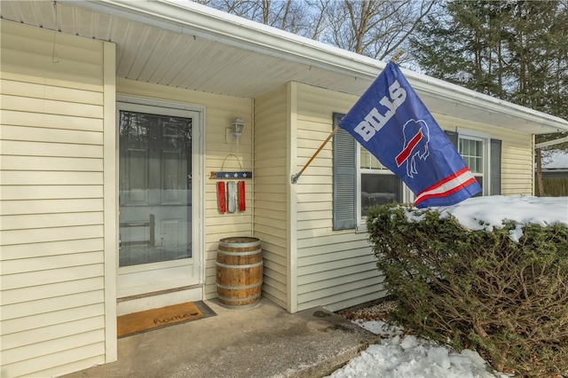 view of snow covered property entrance