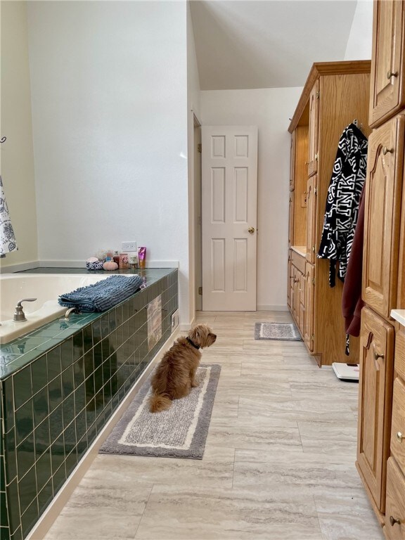 bathroom featuring a garden tub