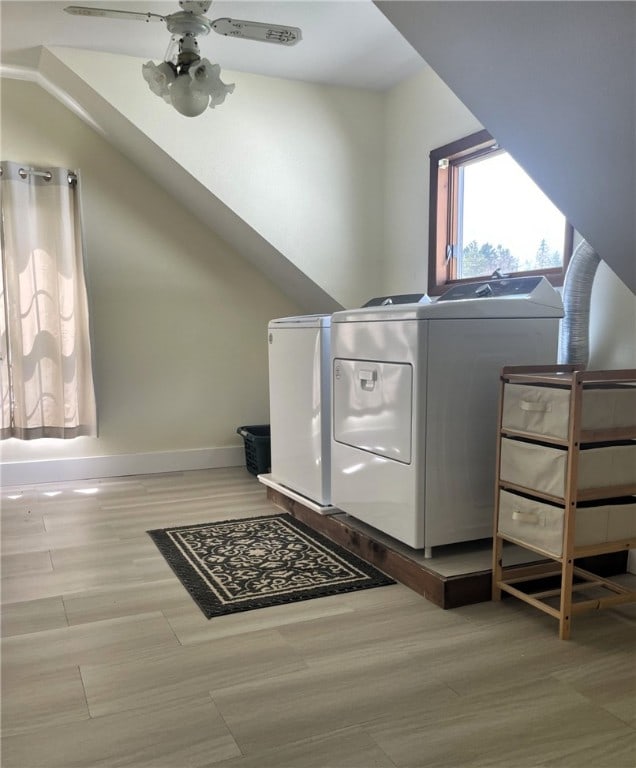 laundry room with laundry area, baseboards, a wealth of natural light, and ceiling fan
