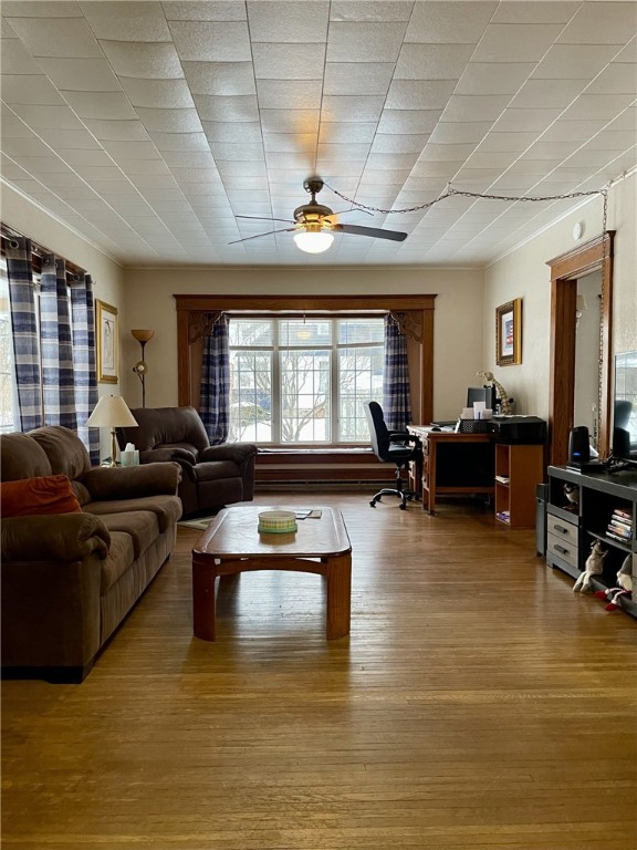 405 2nd Ave, Wayland, NY 14572 - living room with a ceiling fan, hardwood / wood-style flooring, crown molding, and a desk