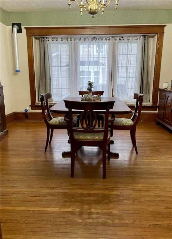 dining room featuring a notable chandelier and light wood-style floors