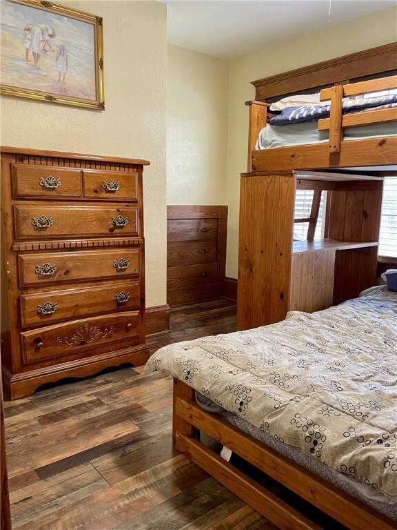 bedroom featuring dark wood-style floors