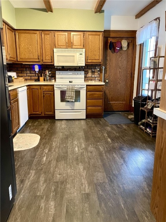 405 2nd Ave, Wayland, NY 14572 - kitchen featuring white appliances, dark wood-type flooring, brown cabinetry, and beamed ceiling