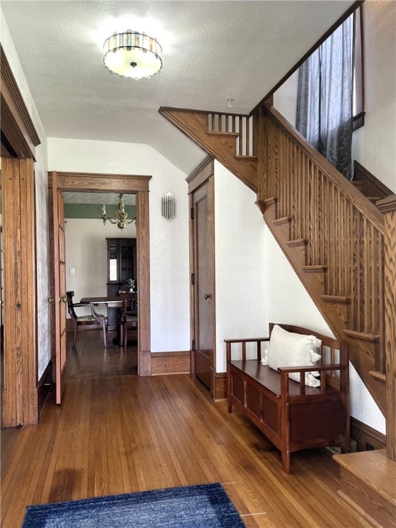 405 2nd Ave, Wayland, NY 14572 - foyer with hardwood / wood-style floors, stairs, a chandelier, and baseboards