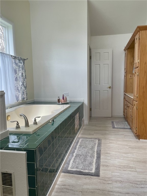 405 2nd Ave, Wayland, NY 14572 - full bathroom with a garden tub and wood finished floors