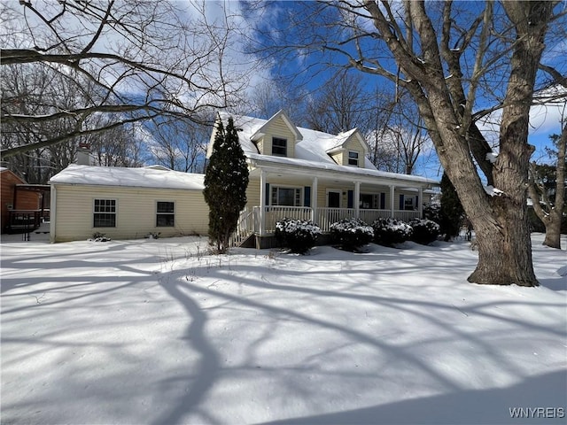 cape cod-style house featuring covered porch