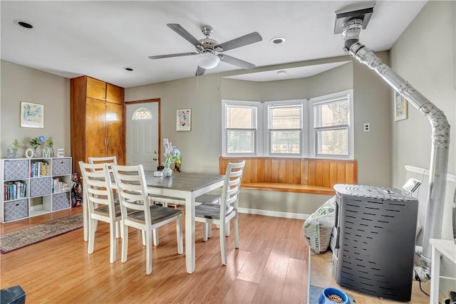 dining area with ceiling fan and light hardwood / wood-style flooring