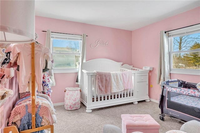 carpeted bedroom with multiple windows