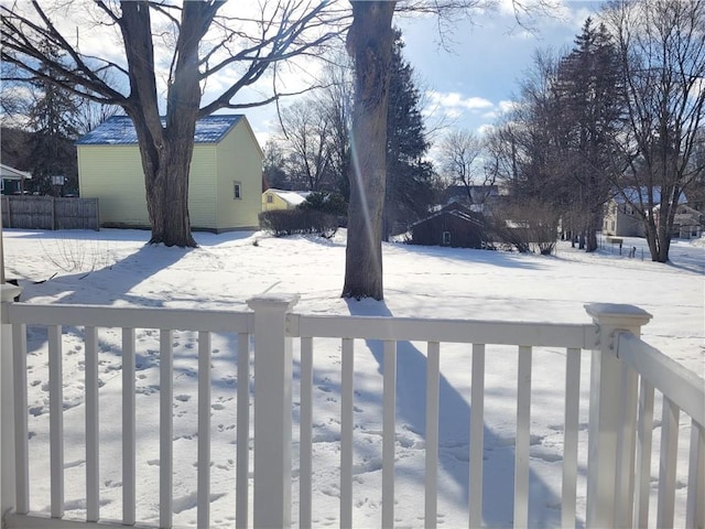 view of yard layered in snow