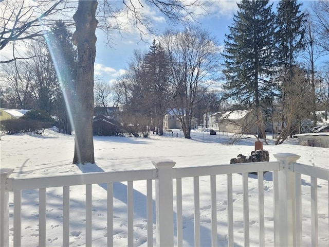 view of yard layered in snow