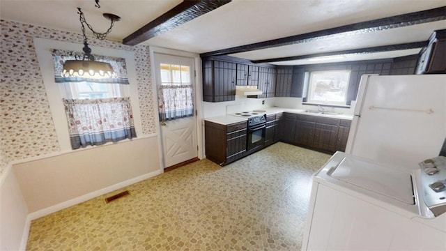 kitchen with black electric range oven, sink, decorative light fixtures, dark brown cabinets, and white refrigerator