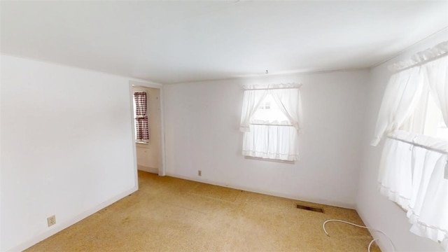 view of carpeted spare room