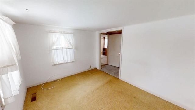 unfurnished room with carpet floors