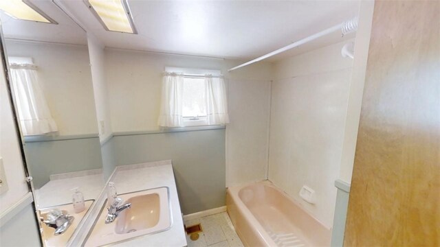 bathroom with vanity and  shower combination