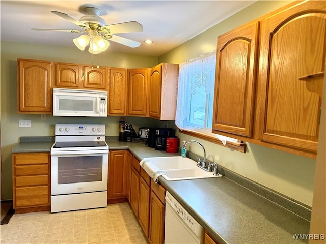 kitchen with ceiling fan, white appliances, and sink