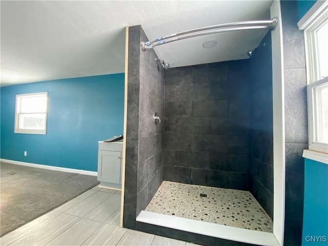 bathroom with a tile shower