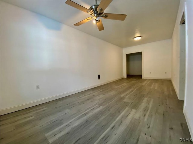 spare room featuring ceiling fan and light hardwood / wood-style flooring