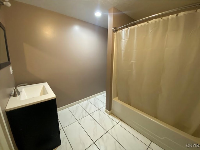 bathroom featuring vanity, tile patterned floors, and shower / bath combo with shower curtain