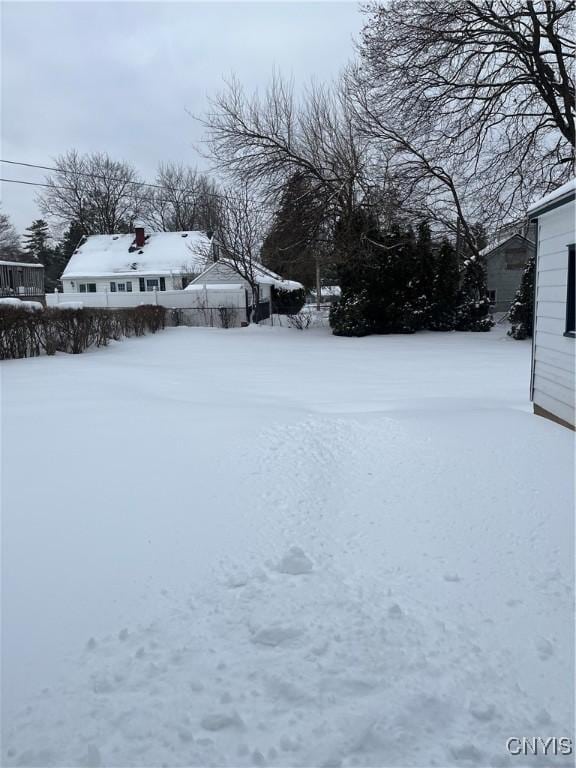 view of yard covered in snow