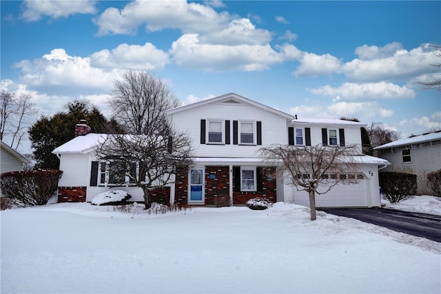 front of property with a garage