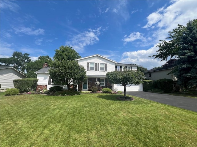 view of front of home with a garage and a front yard