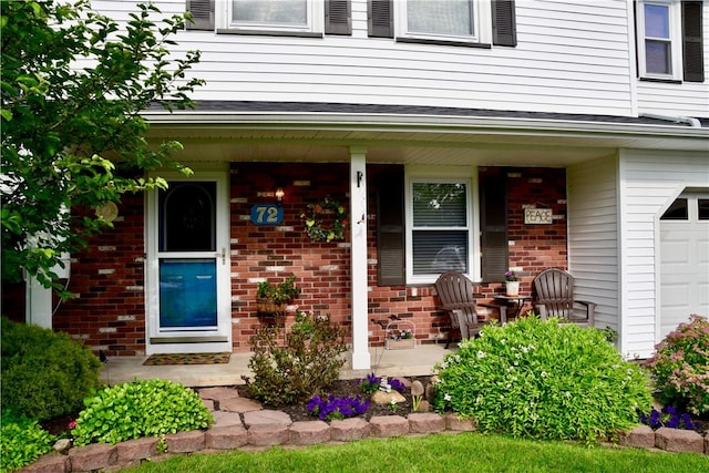 entrance to property featuring covered porch