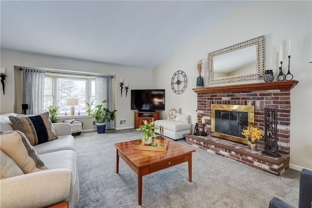 living room with a fireplace, vaulted ceiling, and carpet