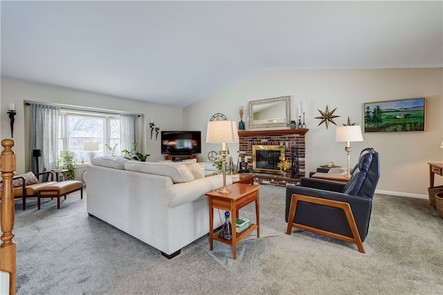 carpeted living room featuring lofted ceiling and a brick fireplace