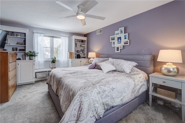 carpeted bedroom with ceiling fan