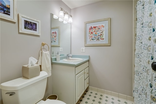 bathroom featuring vanity and toilet