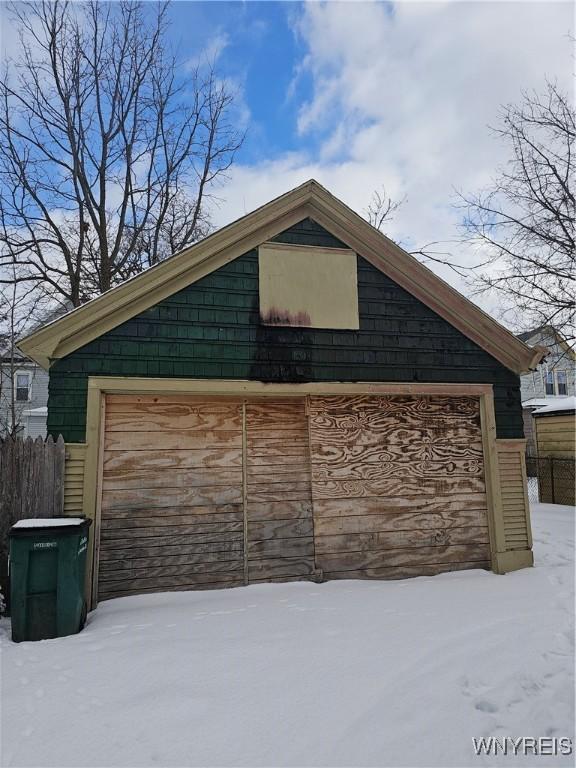 view of snow covered garage