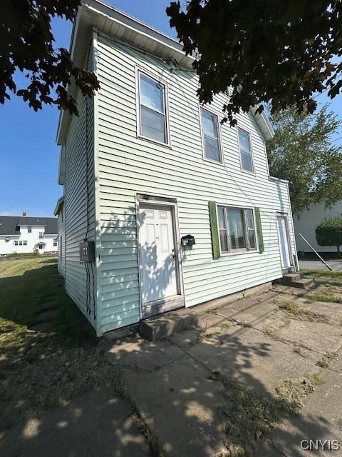 back of property featuring a patio