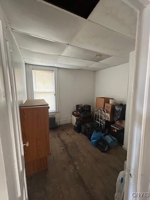 misc room featuring dark hardwood / wood-style floors and radiator heating unit