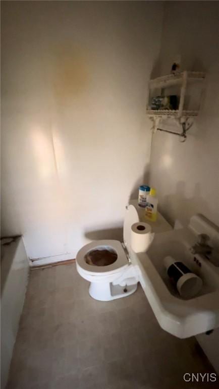 bathroom featuring toilet