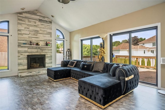 living room featuring high vaulted ceiling and a fireplace