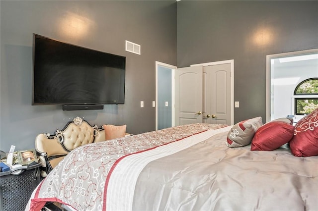 bedroom with a high ceiling