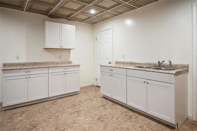 kitchen with sink and white cabinets